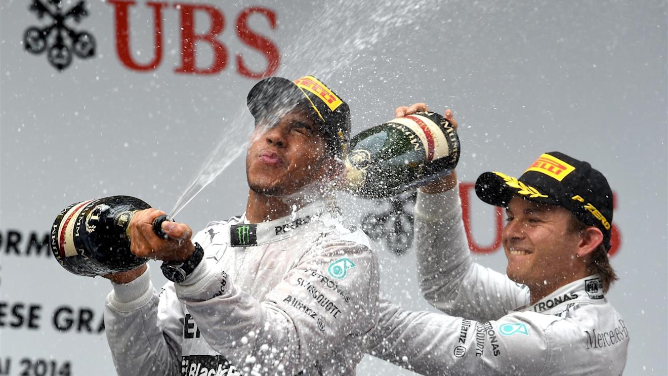 Lewis Hamilton (GBR) Mercedes AMG F1 and Nico Rosberg (GER) Mercedes AMG F1 celebrate on the podium with the champagne. Formula One World Championship, Rd4, Chinese Grand Prix, Race, Shanghai, China, Sunday, 20 April 2014