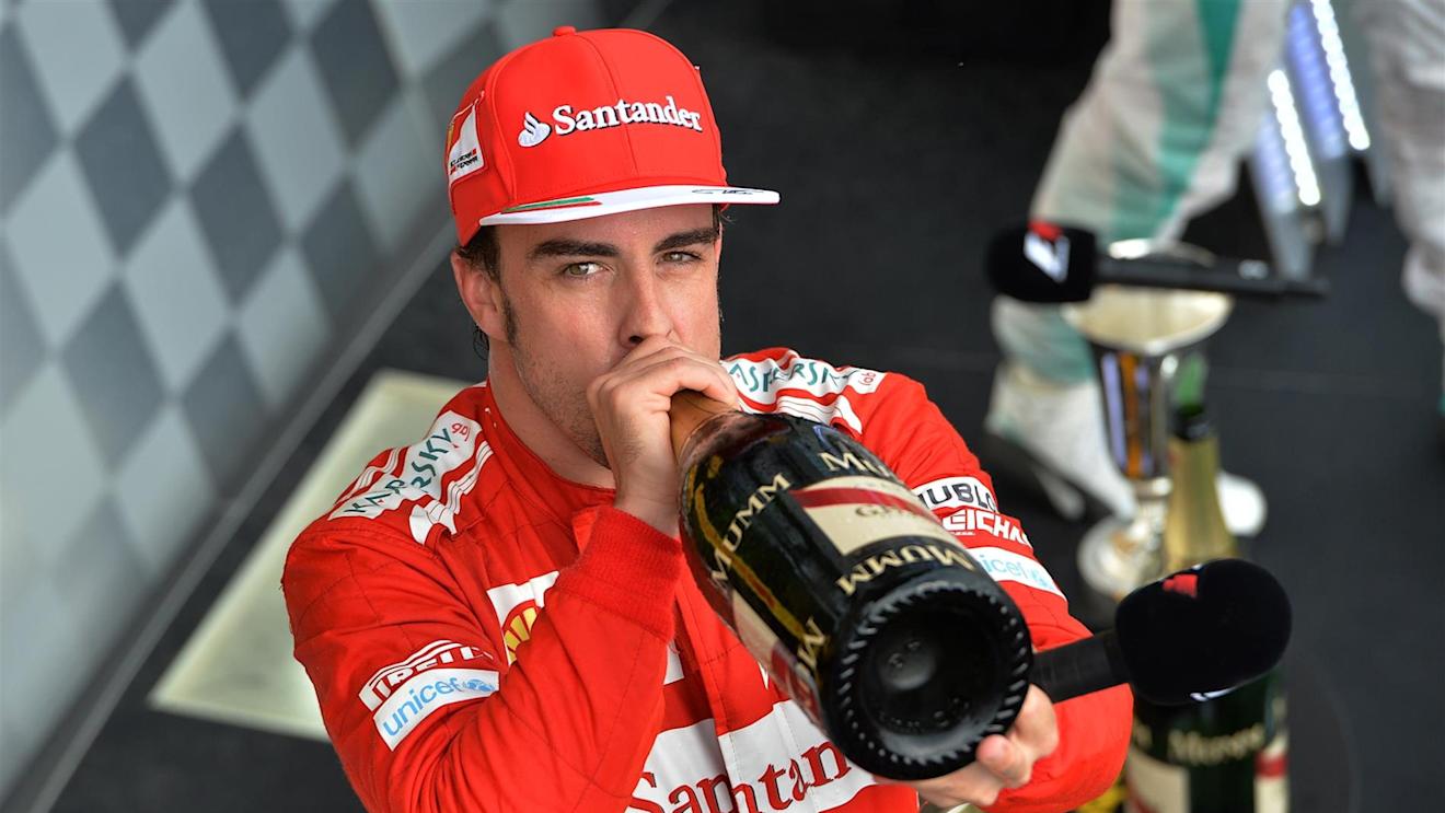 Second placed finisher Fernando Alonso (ESP) Ferrari drinks champagne On the podium. Formula One World Championship, Rd11, Hungarian Grand Prix, Race Day, Hungaroring, Hungary. Sunday, 27 July 2014 © Sutton Images. No reproduction without permission