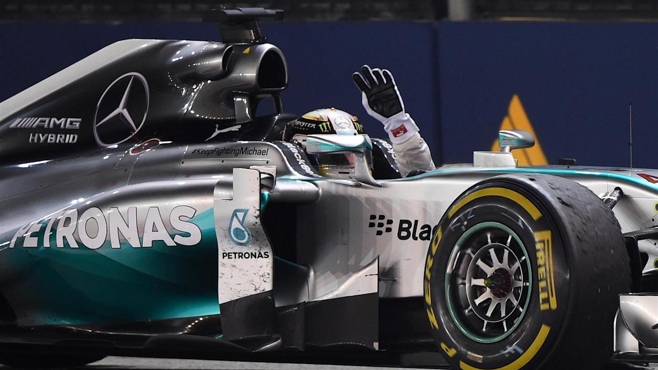 Race winner Lewis Hamilton (GBR) Mercedes AMG F1 W05 celebrates. Formula One World Championship, Rd14, Singapore Grand Prix, Marina Bay Street Circuit, Singapore, Race Day, Sunday, 21 September 2014 © Sutton Images. No reproduction without permission