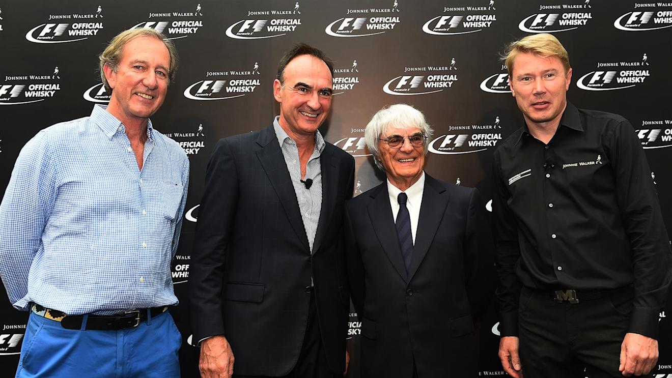 Nick Blazquez, President of Diageo in Africa and Asia with Bernie Ecclestone (GBR) CEO Formula One Group (FOM), Mika Hakkinen (FIN) and Robbie Walker (GBR). Formula One World Championship, Rd14, Singapore Grand Prix, Marina Bay Street Circuit, Singapore, Preparations, Thursday, 18 September 2014 © Sutton Images. No reproduction without permission