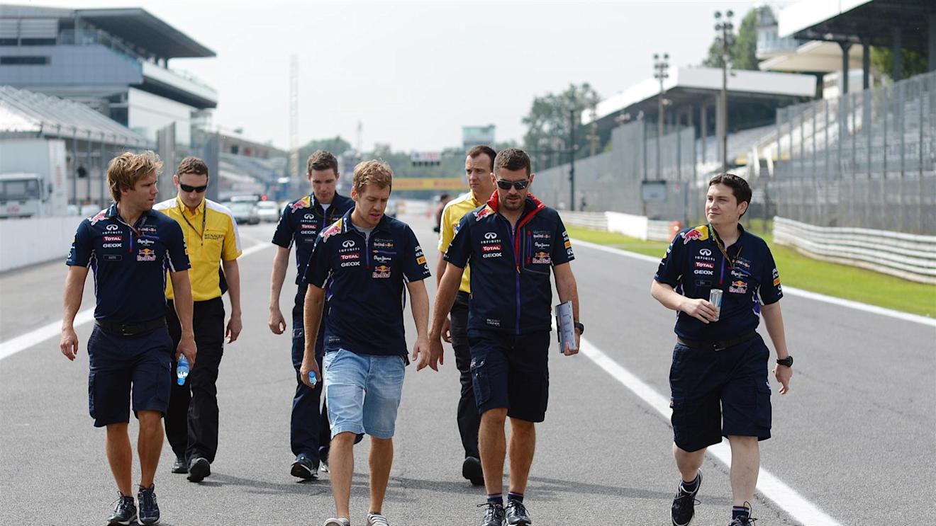 Sebastian Vettel (GER) Red Bull Racing walks the track with Tim Malyon (GBR) Red Bull Racing Performance Engineer, Guillaume Rocquelin (FRA) Red Bull Racing Race Engineer, Michael Manning (GBR) Red Bull Racing Trackside Control Engineer and Antti Kontsas (FIN) Personal Trainer of Sebastian Vettel (GER) Red Bull Racing. Formula One World Championship, Rd13, Italian Grand Prix, Monza, Italy, Preparations, Thursday, 4 September 2014 © Sutton Images. No reproduction without permission