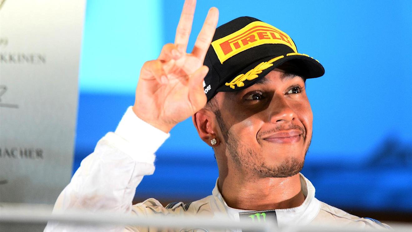 Race winner Lewis Hamilton (GBR) Mercedes AMG F1 celebrates on the podium. Formula One World Championship, Rd14, Singapore Grand Prix, Marina Bay Street Circuit, Singapore, Race Day, Sunday, 21 September 2014 © Sutton Images. No reproduction without permission