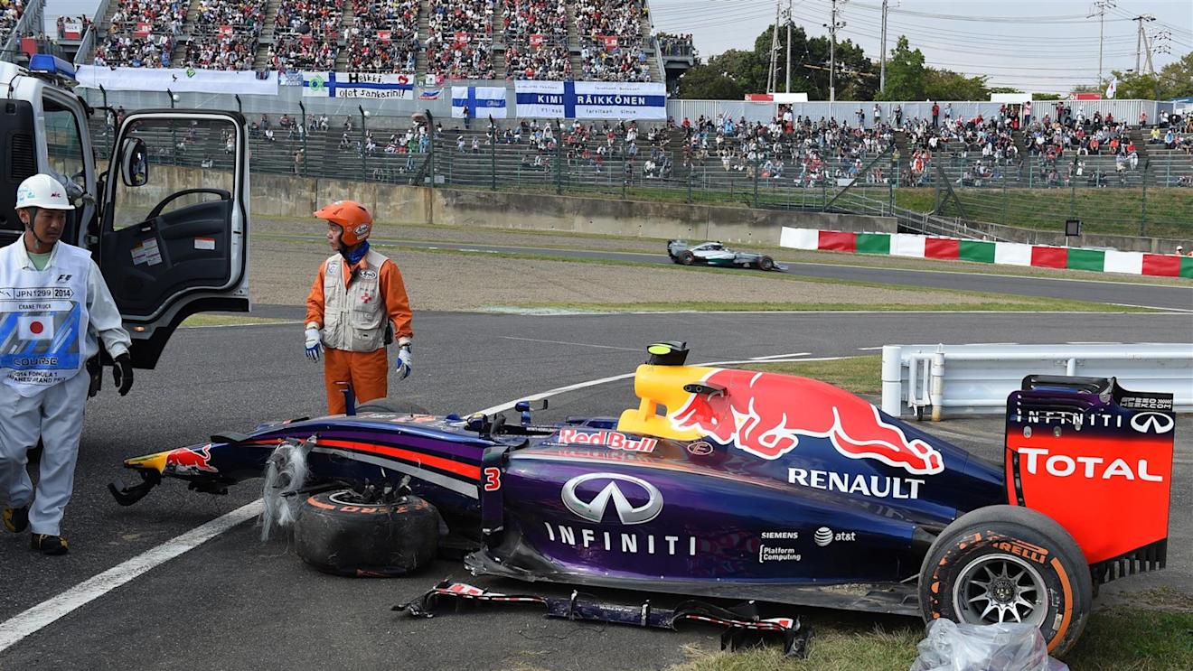 The crashed car of Daniel Ricciardo (AUS) Red Bull Racing RB10 is recovered in FP2. Formula One World Championship, Rd15, Japanese Grand Prix, Practice, Suzuka, Japan, Friday, 3 October 2014