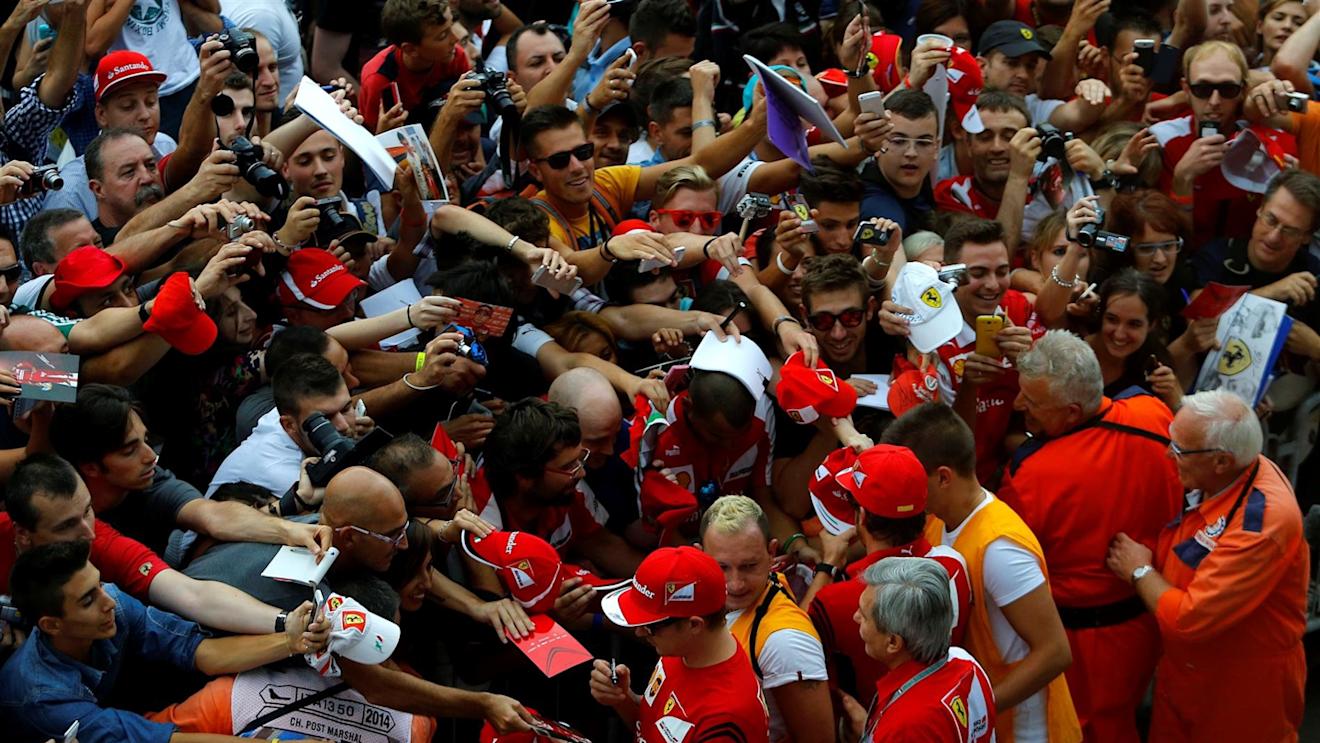 Kimi Raikkonen (FIN) Ferrari and Fernando Alonso (ESP) Ferrari sign autographs for the fans. Formula One World Championship, Rd13, Italian Grand Prix, Monza, Italy, Preparations, Thursday, 4 September 2014 © Sutton Images. No reproduction without permission