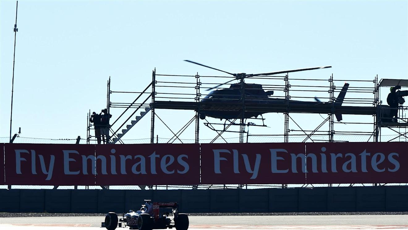 Jean-Eric Vergne (FRA) Scuderia Toro Rosso STR9 and helicopter. Formula One World Championship, Rd17, United States Grand Prix, Qualifying, Austin, Texas, USA, Saturday, 1 November 2014