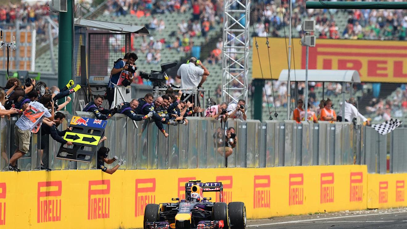 Race winner Daniel Ricciardo (AUS) Red Bull Racing RB10 crosses the line. Formula One World Championship, Rd11, Hungarian Grand Prix, Race Day, Hungaroring, Hungary. Sunday, 27 July 2014. © Sutton Images