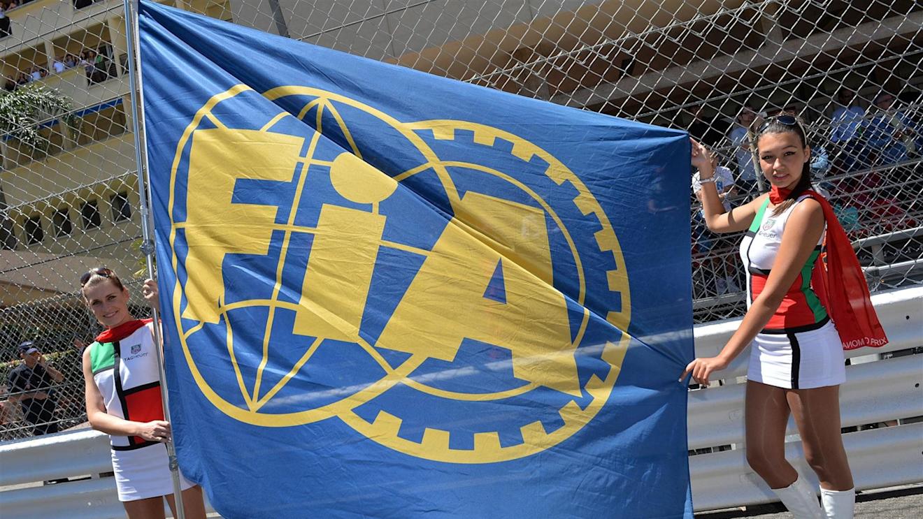 Girls on the grid with an FIA flag. Formula One World Championship, Rd6, Monaco Grand Prix, Race Day, Monte-Carlo, Monaco, Sunday, 26 May 2013. © Sutton Images