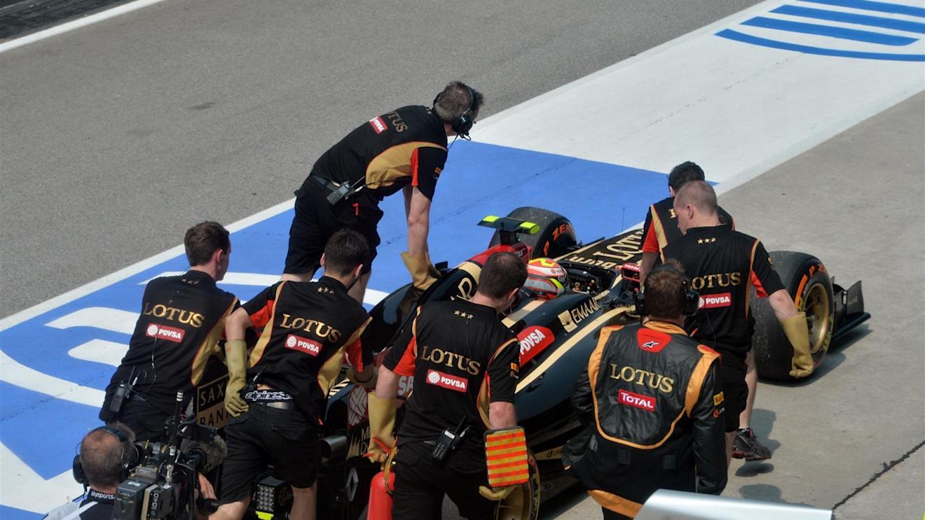 Pastor Maldonado (VEN) Lotus E22 is pushed along pit lane. Formula One World Championship, Rd2, Malaysian Grand Prix, Practice, Sepang, Malaysia, Friday, 28 March 2014. © Sutton Images