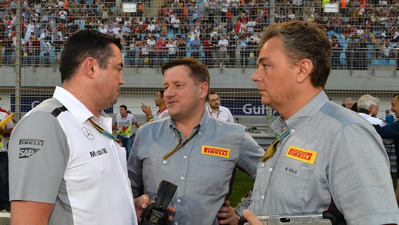 (L to R): Eric Boullier (FRA) McLaren Racing Director, Paul Hembery (GBR) Pirelli Motorsport Director and Mario Isola (ITA) Pirelli Sporting Director on the grid. Formula One World Championship, Rd3, Bahrain Grand Prix, Race, Bahrain International Circuit, Sakhir, Bahrain, Sunday, 6 April 2014. © Sutton Images