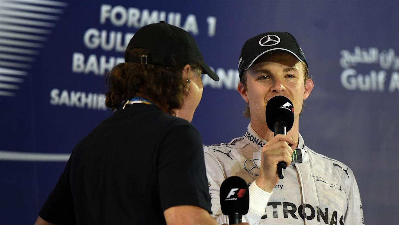 Nico Rosberg (GER) Mercedes AMG F1 is interviewed by Brian Johnson (GBR) AC/DC lead singer on the podium. Formula One World Championship, Rd3, Bahrain Grand Prix, Race, Bahrain International Circuit, Sakhir, Bahrain, Sunday, 6 April 2014. © Sutton Images