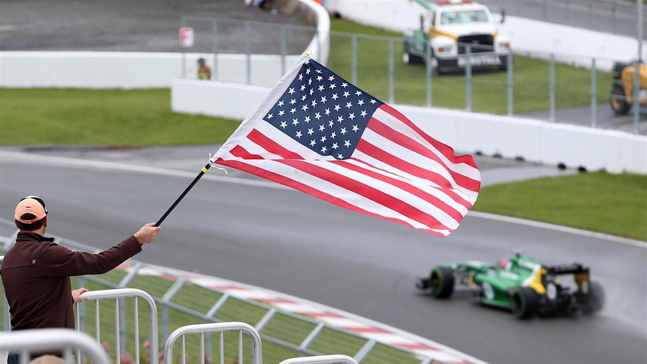 A fan waves the Stars and Stripes for Alexander Rossi (USA) Caterham third driver. Formula One World Championship, Rd7, Canadian Grand Prix, Practice, Montreal, Canada, Friday, 7 June 2013. © Sutton Images