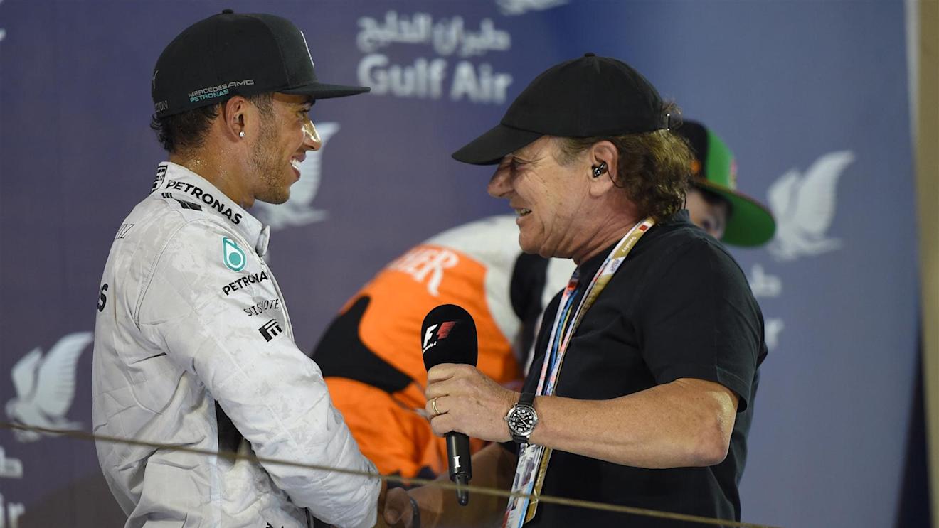 Race winner Lewis Hamilton (GBR) Mercedes AMG F1 with Brian Johnson (GBR) AC/DC lead singer on the podium. Formula One World Championship, Rd3, Bahrain Grand Prix, Race, Bahrain International Circuit, Sakhir, Bahrain, Sunday, 6 April 2014. © Sutton Images
