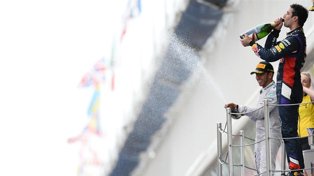 Race winner Lewis Hamilton (GBR) Mercedes AMG F1 and Daniel Ricciardo (AUS) Red Bull Racing celebrates on the podium with the champagne. Formula One World Championship, Rd5, Spanish Grand Prix, Race, Barcelona, Spain, Sunday, 11 May 2014. © Sutton Images