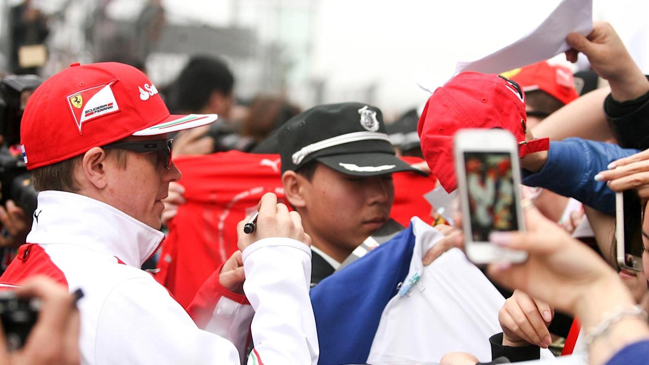 Kimi Raikkonen (FIN) Ferrari signs autographs for the fans. Formula One World Championship, Rd4, Chinese Grand Prix, Preparations, Shanghai, China, Thursday, 17 April 2014. © Sutton Images