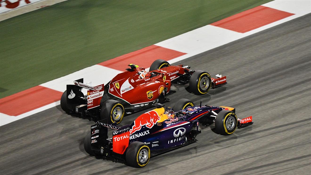 Sebastian Vettel (GER) Red Bull Racing RB10 and Kimi Raikkonen (FIN) Ferrari F14 T. Formula One World Championship, Rd3, Bahrain Grand Prix, Race, Bahrain International Circuit, Sakhir, Bahrain, Sunday, 6 April 2014. © Sutton Images