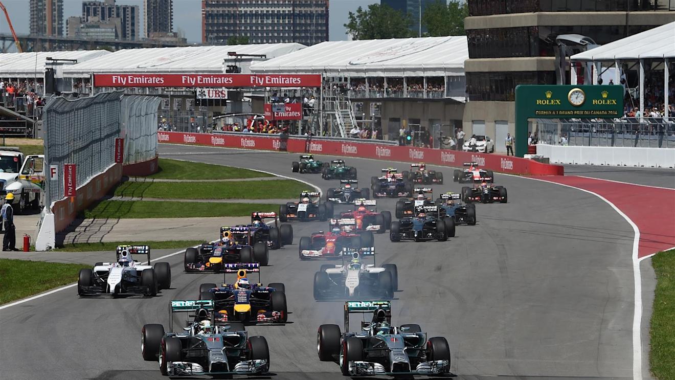 Nico Rosberg (GER) Mercedes AMG F1 W05 and Lewis Hamilton (GBR) Mercedes AMG F1 W05 at the start of the race. Formula One World Championship, Rd7, Canadian Grand Prix, Qualifying, Montreal, Canada, Sunday, 8 June 2014. © Sutton Images