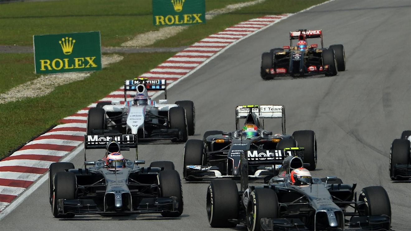 Kevin Magnussen (DEN) McLaren MP4-29 leads Jenson Button (GBR) McLaren MP4-29. Formula One World Championship, Rd2, Malaysian Grand Prix, Race, Sepang, Malaysia, Sunday, 30 March 2014. © Sutton Images