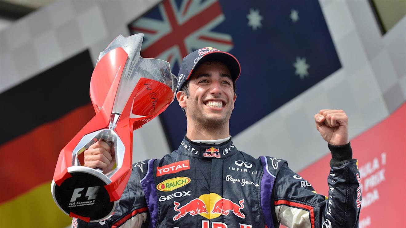 Race winner Daniel Ricciardo (AUS) Red Bull Racing celebrates on the podium with the trophy. Formula One World Championship, Rd7, Canadian Grand Prix, Race Day, Montreal, Canada, Sunday, 8 June 2014. © Sutton Images