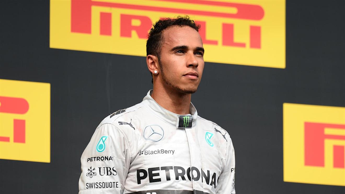 Lewis Hamilton (GBR) Mercedes AMG F1 on the podium. Formula One World Championship, Rd11, Hungarian Grand Prix, Race Day, Hungaroring, Hungary. Sunday, 27 July 2014