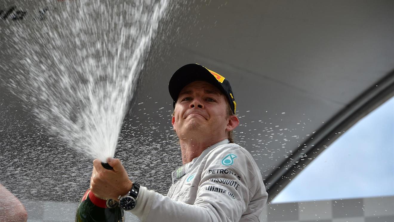 Race winner Nico Rosberg (GER) Mercedes AMG F1 celebrates with the champagne on the podium. Formula One World Championship, Rd8, Austrian Grand Prix, Race, Spielberg, Austria, Sunday, 22 June 2014