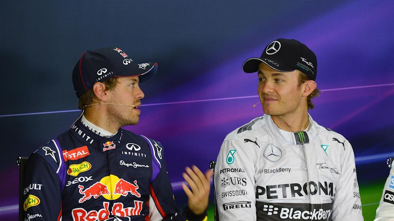 Sebastian Vettel (GER) Red Bull Racing and Nico Rosberg (GER) Mercedes AMG F1 in the Press Conference. Formula One World Championship, Rd9, British Grand Prix, Qualifying, Silverstone, England, Saturday, 5 July 2014