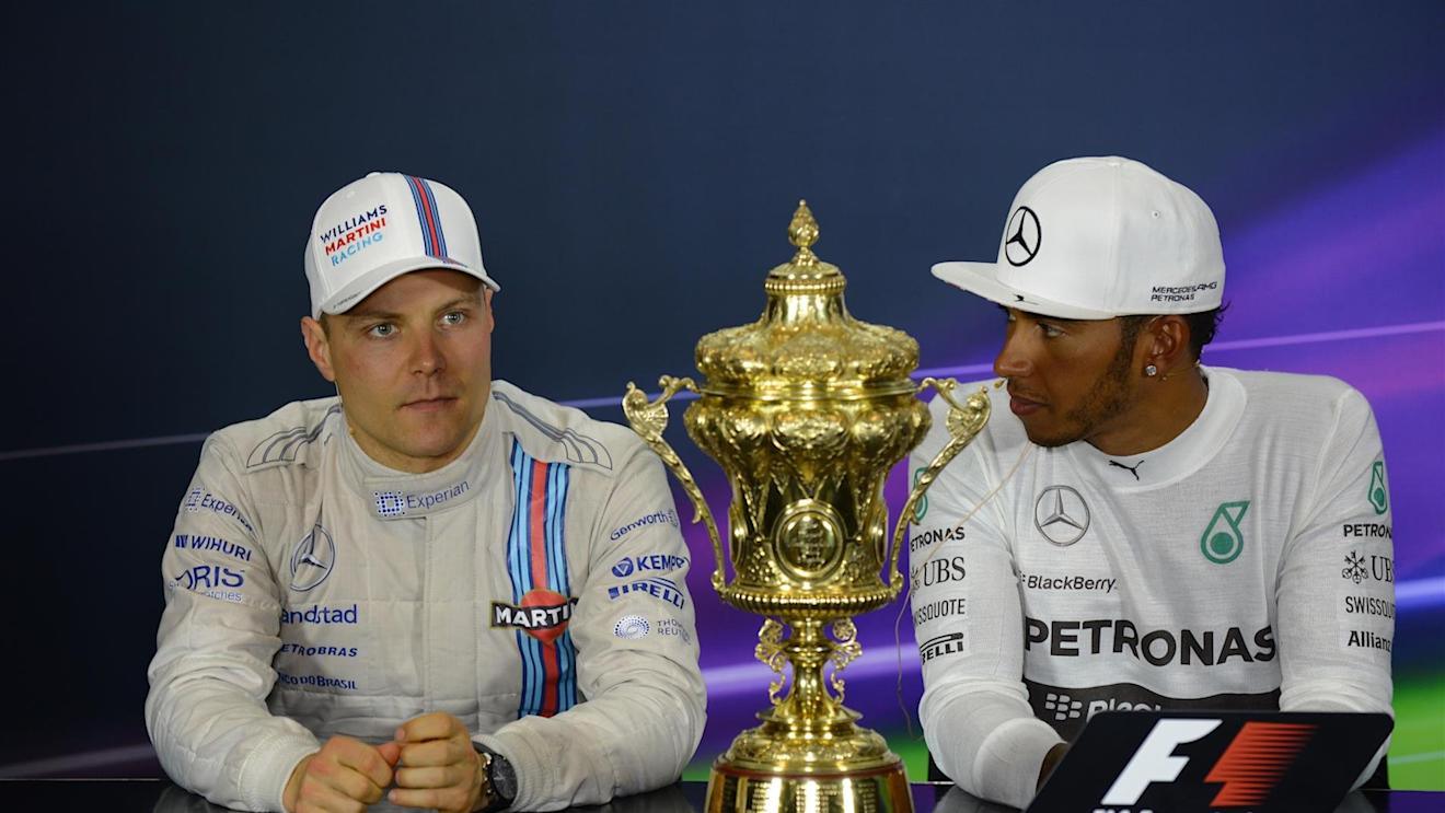 (L to R): Valtteri Bottas (FIN) Williams, race winner Lewis Hamilton (GBR) Mercedes AMG F1 in the Press Conference with the trophy. Formula One World Championship, Rd9, British Grand Prix, Race Day, Silverstone, England, Sunday, 6 July 2014