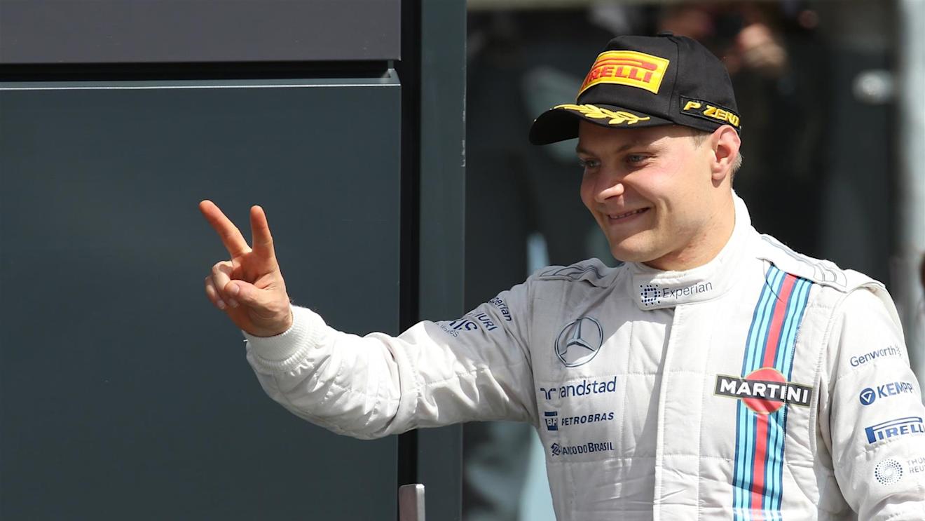 Second placed Valtteri Bottas (FIN) Williams Martini Racing on the podium. Formula One World Championship, Rd9, British Grand Prix, Race Day, Silverstone, England, Sunday, 6 July 2014. © Sutton Images