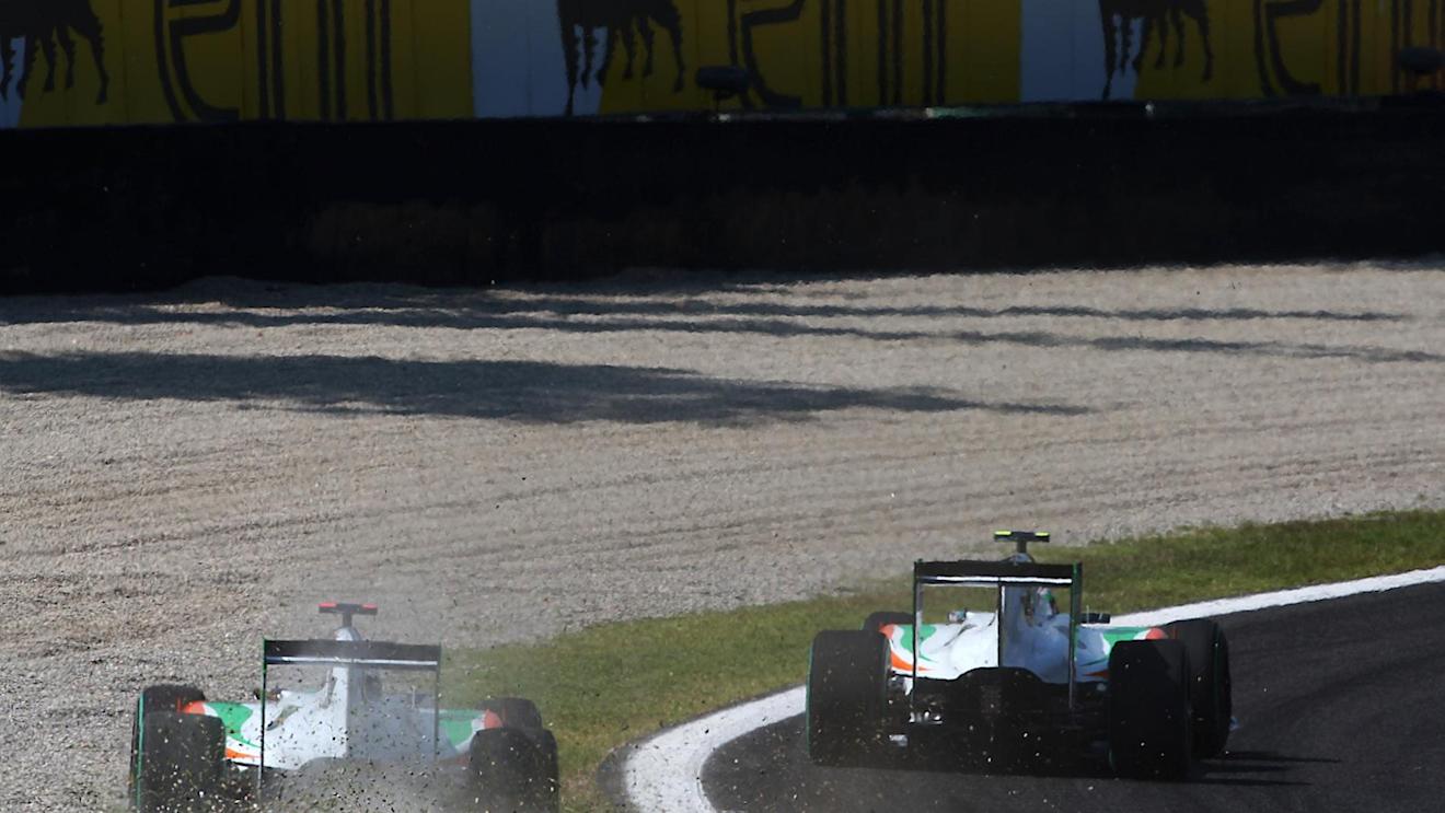 Adrian Sutil (GER) Force India F1 VJM03 runs wide at Parabolica after battling with team mate Vitantonio Liuzzi (ITA) Force India F1 VJM03. Formula One World Championship, Rd 14, Italian Grand Prix, Race, Monza, Italy, Sunday, 12 September 2010. © Sutton Images