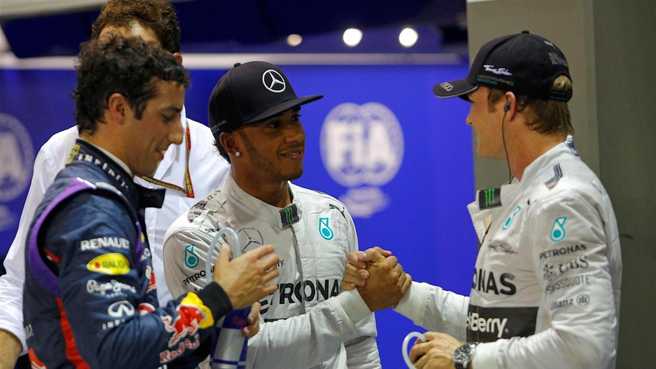 (L to R): Daniel Ricciardo (AUS) Red Bull Racing, pole sitter Lewis Hamilton (GBR) Mercedes AMG F1 and Nico Rosberg (GER) Mercedes AMG F1 celebrate in parc ferme. Formula One World Championship, Rd14, Singapore Grand Prix, Marina Bay Street Circuit, Singapore, Qualifying, Saturday, 20 September 2014 