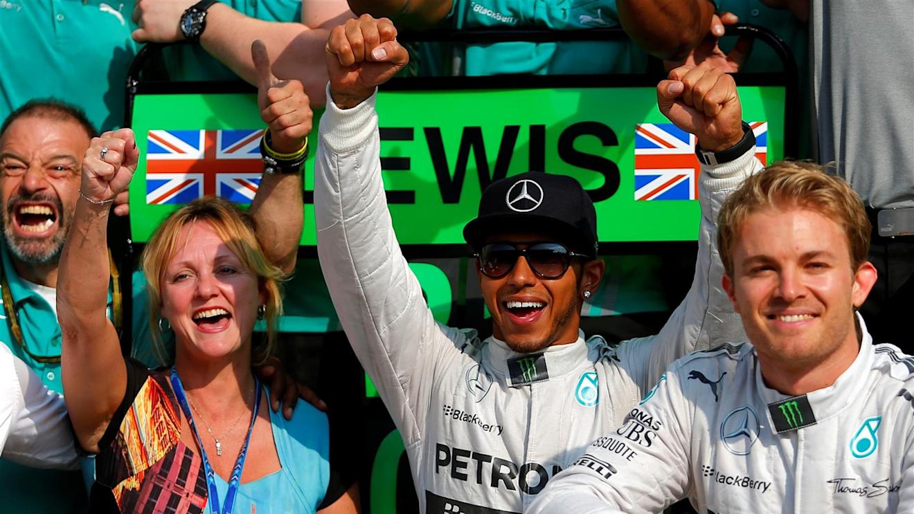 Race winner Lewis Hamilton (GBR) Mercedes AMG F1 celebrates with Step Mother Linda Hamilton (GBR) and Nico Rosberg (GER) Mercedes AMG F1. Formula One World Championship, Rd13, Italian Grand Prix, Monza, Italy, Race Day, Sunday, 7 September 2014