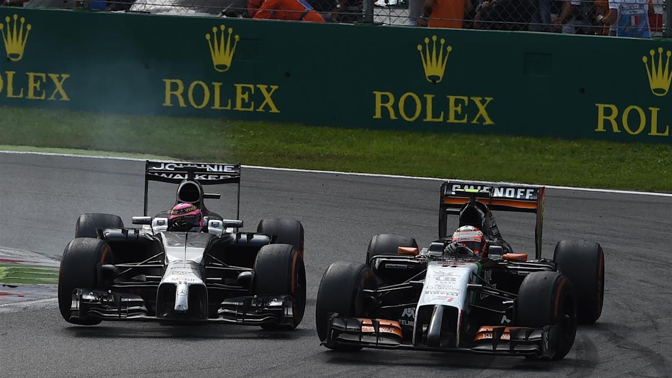 Jenson Button (GBR) McLaren MP4-29 and Sergio Perez (MEX) Force India VJM07 battle. Formula One World Championship, Rd13, Italian Grand Prix, Monza, Italy, Race Day, Sunday, 7 September 2014