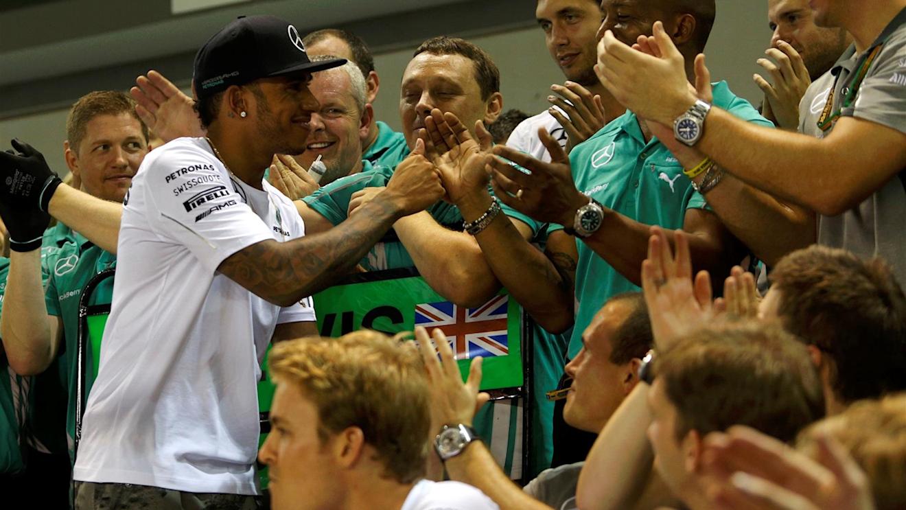 Race winner Lewis Hamilton (GBR) Mercedes AMG F1 celebrates with the team. Formula One World Championship, Rd14, Singapore Grand Prix, Marina Bay Street Circuit, Singapore, Race Day, Sunday, 21 September 2014