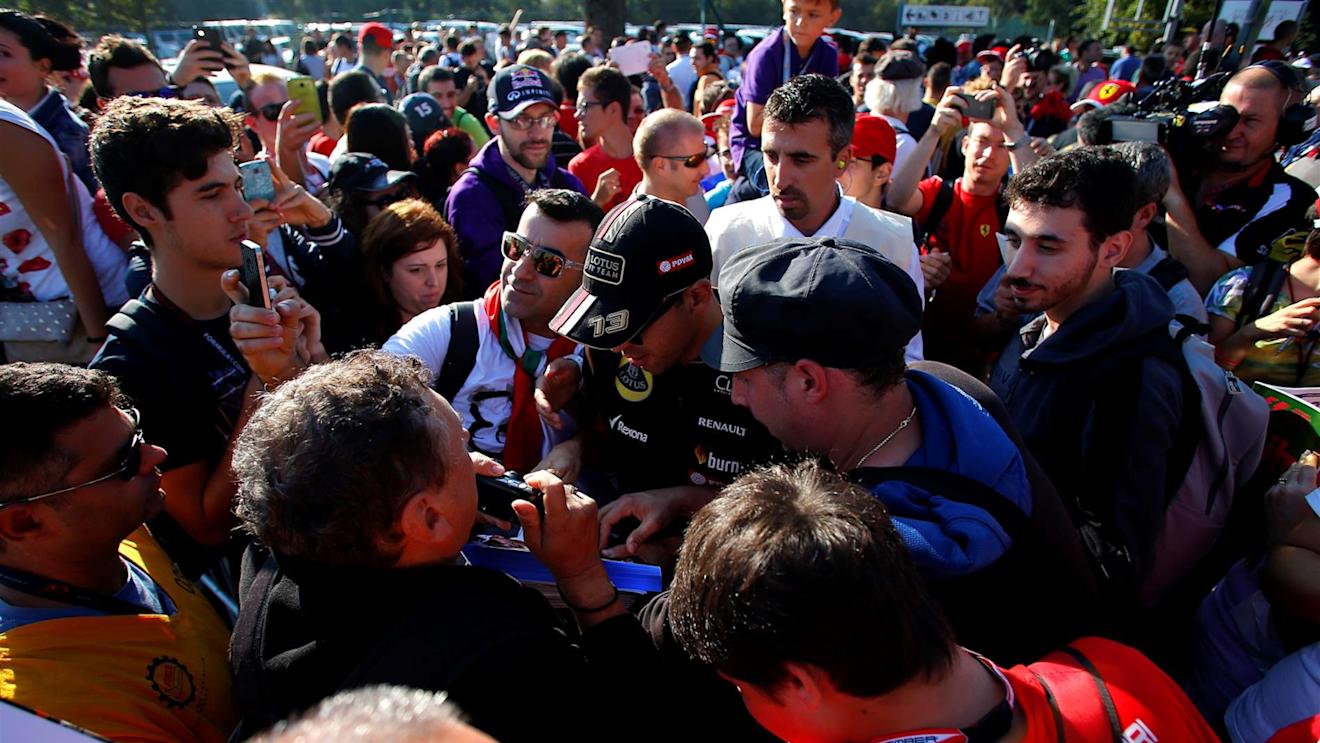 Pastor Maldonado (VEN) Lotus arrives at the track and signs autographs for the fans. Formula One World Championship, Rd13, Italian Grand Prix, Monza, Italy, Qualifying, Saturday, 6 September 2014