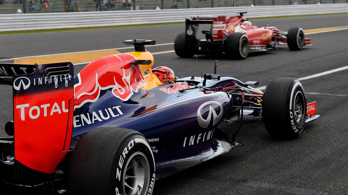 (L to R): Sebastian Vettel (GER) Red Bull Racing RB10 and Fernando Alonso (ESP) Ferrari F14 T. Formula One World Championship, Rd15, Japanese Grand Prix, Practice, Suzuka, Japan, Friday, 3 October 2014