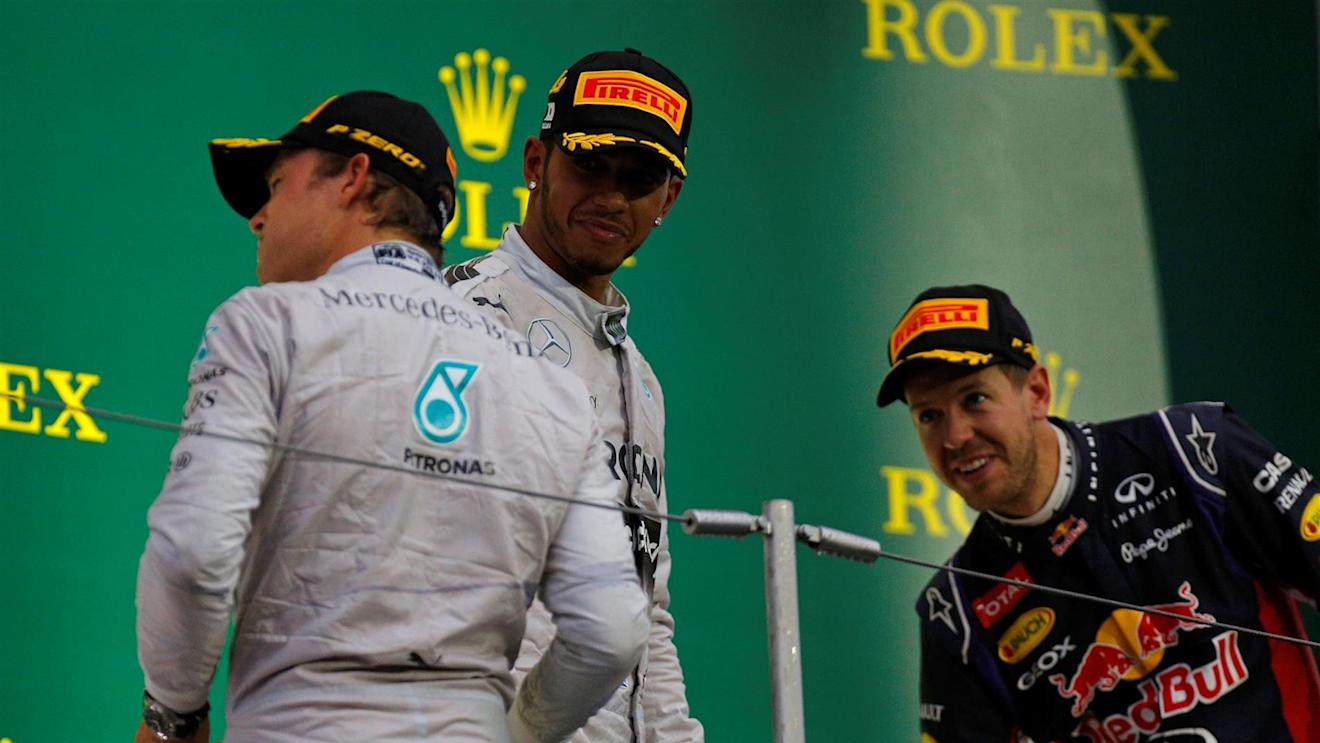Lewis Hamilton (GBR) Mercedes AMG F1, Nico Rosberg (GER) Mercedes AMG F1 and Sebastian Vettel (GER) Red Bull Racing on the podium with the champagne. Formula One World Championship, Rd15, Japanese Grand Prix, Race, Suzuka, Japan, Sunday, 5 October 2014