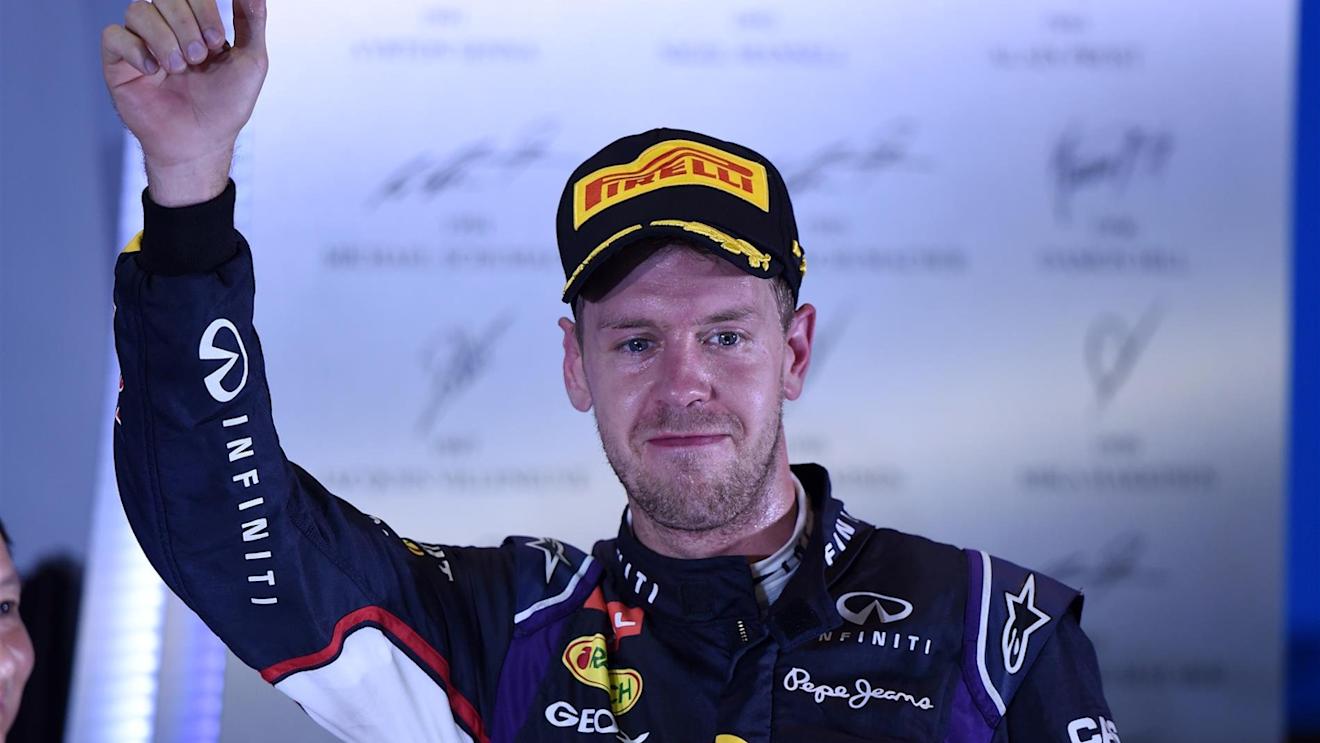 Sebastian Vettel (GER) Red Bull Racing celebrates on the podium. Formula One World Championship, Rd14, Singapore Grand Prix, Marina Bay Street Circuit, Singapore, Race Day, Sunday, 21 September 2014