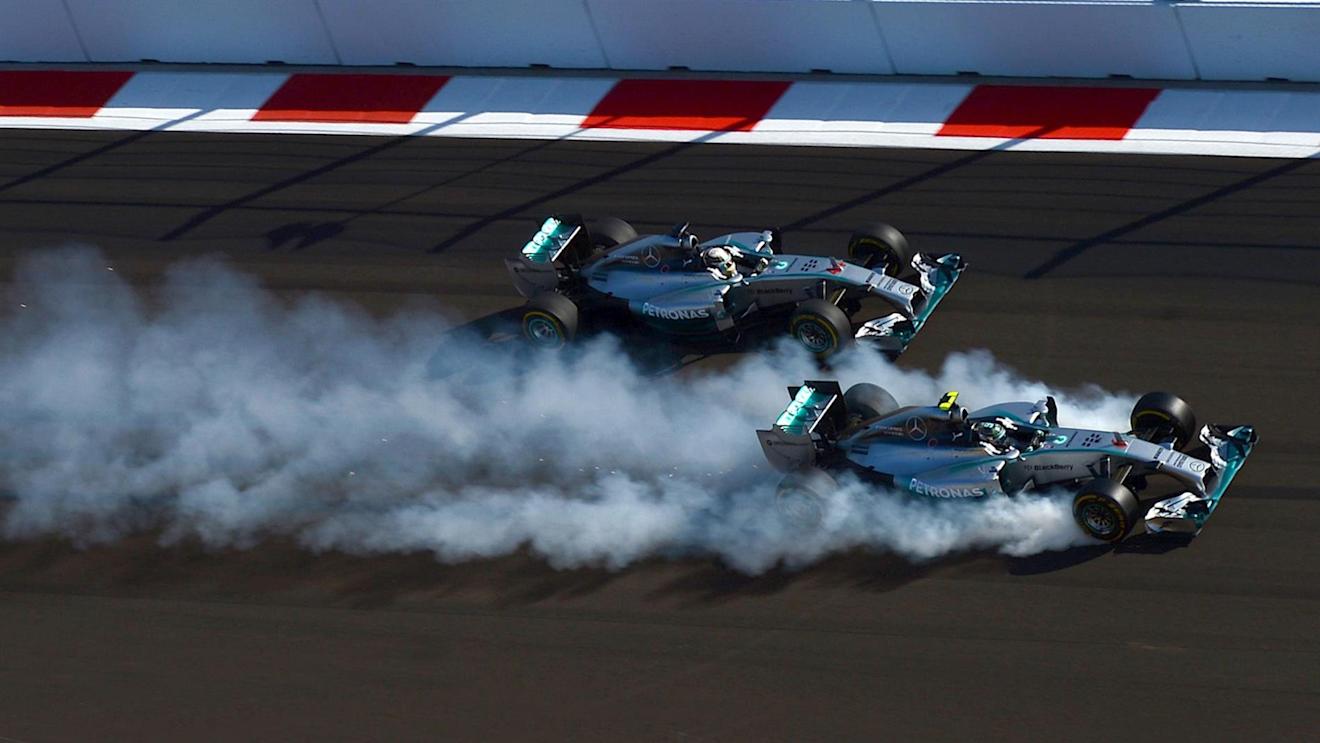 Nico Rosberg (GER) Mercedes AMG F1 W05 locks up inside Lewis Hamilton (GBR) Mercedes AMG F1 W05 at the start of the race. Formula One World Championship, Rd16, Russian Grand Prix, Race, Sochi Autodrom, Sochi, Krasnodar Krai, Russia, Sunday, 12 October 2014