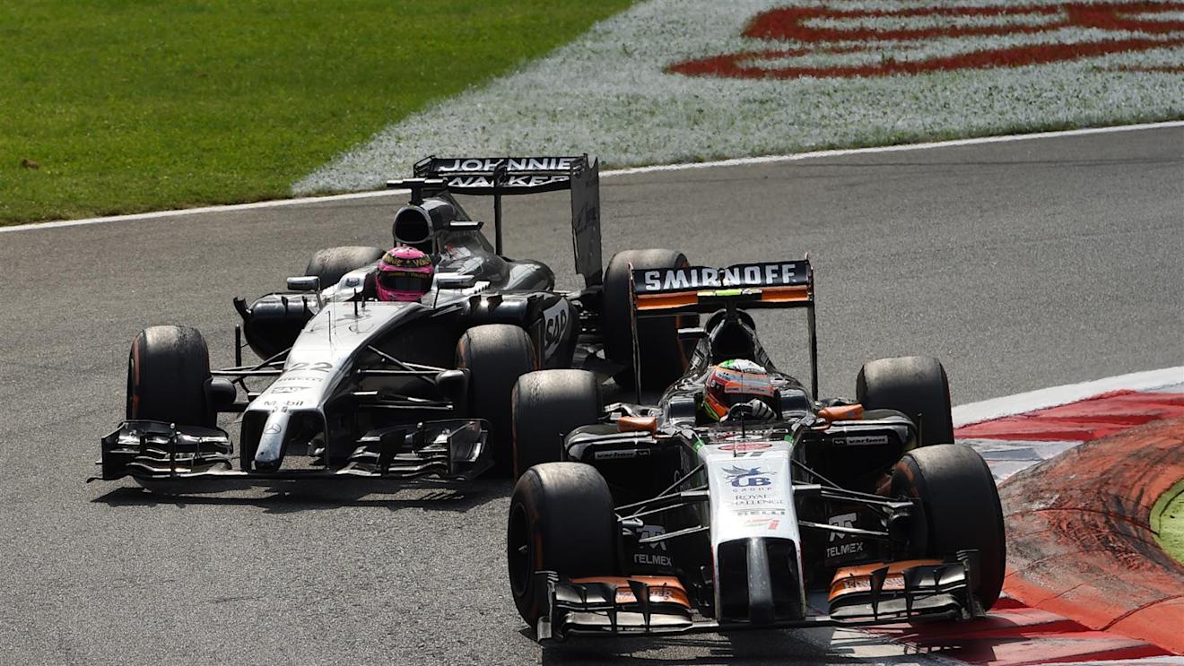 Sergio Perez (MEX) Force India VJM07 leads Jenson Button (GBR) McLaren MP4-29. Formula One World Championship, Rd13, Italian Grand Prix, Monza, Italy, Race Day, Sunday, 7 September 2014