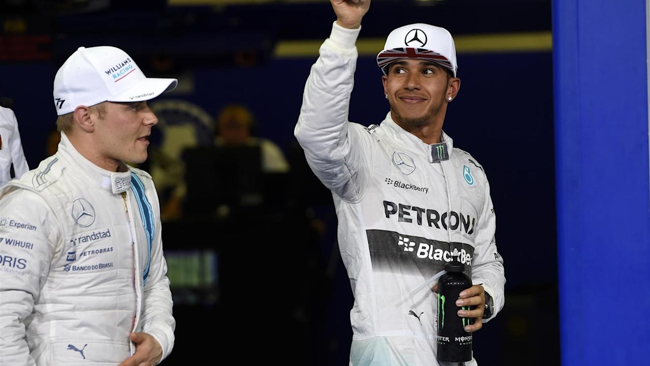 Lewis Hamilton (GBR) Mercedes AMG F1 celebrates his second place in qualifying in parc ferme. Valtteri Bottas (FIN) Williams Martini Racing, left, was third. Formula One World Championship, Rd19, Abu Dhabi Grand Prix, Qualifying, Yas Marina Circuit, Abu Dhabi, UAE, Saturday, 22 November 2014