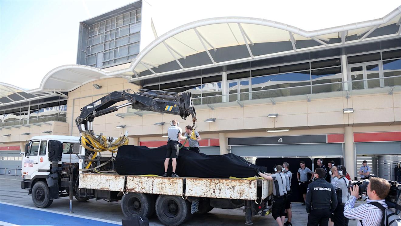 The car of Nico Rosberg (GER) Mercedes AMG F1 is returned to the pits on a truck. Formula One Testing, Day Two, Bahrain International Circuit, Sakhir, Bahrain, Thursday, 20 February 2014