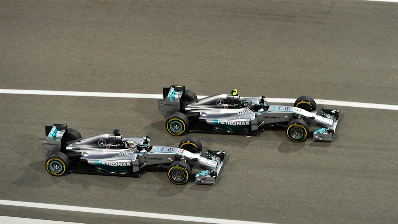 Lewis Hamilton (GBR) Mercedes AMG F1 W05 and Nico Rosberg (GER) Mercedes AMG F1 W05 battle. Formula One World Championship, Rd3, Bahrain Grand Prix, Race, Bahrain International Circuit, Sakhir, Bahrain, Sunday, 6 April 2014