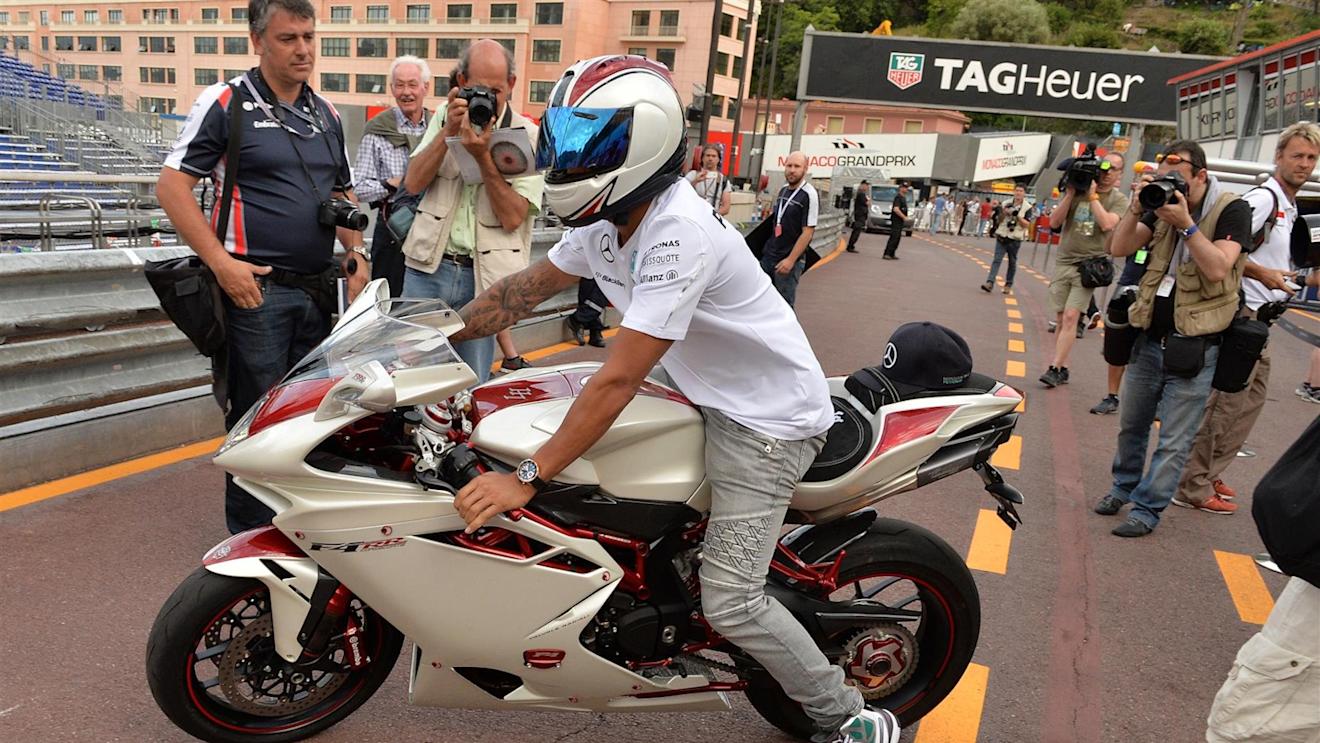 Lewis Hamilton (GBR) Mercedes AMG F1 riding an Agusta F4 RR motorcycle. Formula One World Championship, Rd6, Monaco Grand Prix, Preparations, Monte-Carlo, Monaco, Wednesday, 21 May 2014