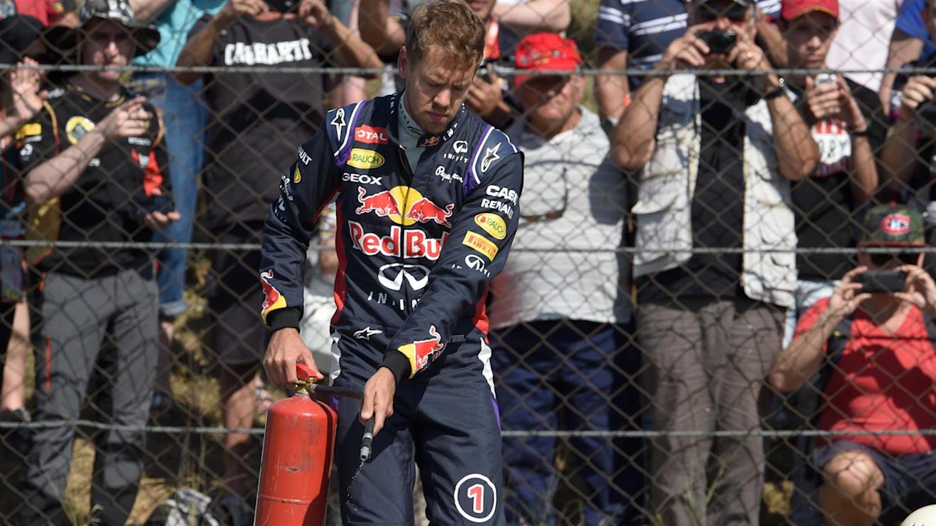 Sebastian Vettel (GER) Red Bull Racing RB10 stops on track in the first practice session with fire extinguisher. Formula One World Championship, Rd5, Spanish Grand Prix, Practice, Barcelona, Spain, Friday, 9 May 2014