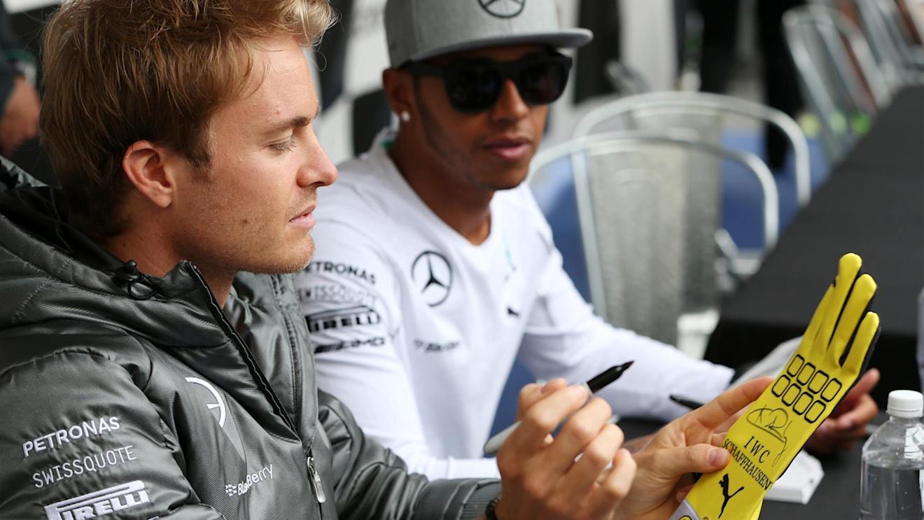 Lewis Hamilton (GBR) Mercedes AMG F1 and Nico Rosberg (GER) Mercedes AMG F1 sign autographs for the fans. Formula One World Championship, Rd7, Canadian Grand Prix, Preparations, Montreal, Canada, Thursday, 5 June 2014