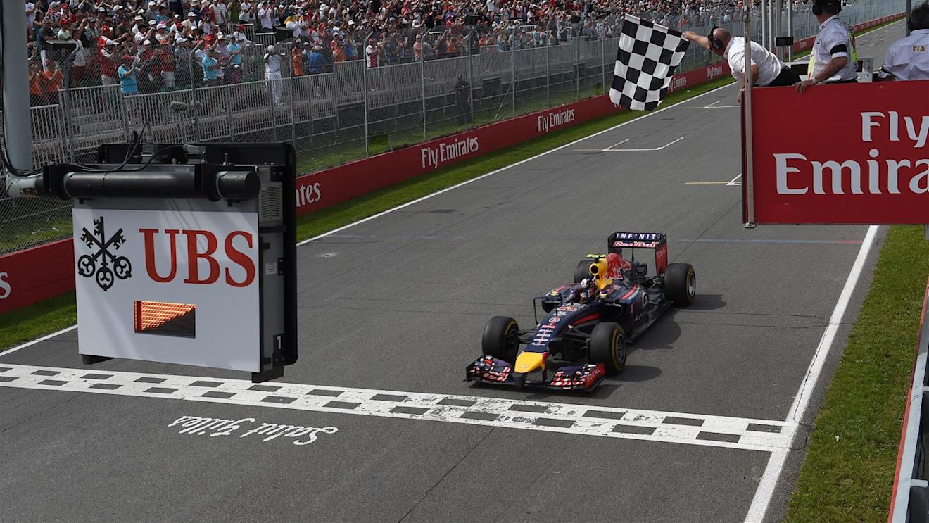 Race winner Daniel Ricciardo (AUS) Red Bull Racing RB10 crosses the line to take the chequered flag. Formula One World Championship, Rd7, Canadian Grand Prix, Race Day, Montreal, Canada, Sunday, 8 June 2014