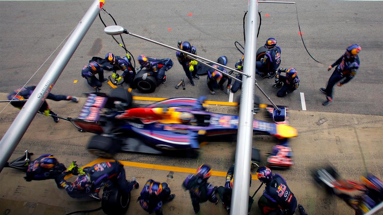 Sebastian Vettel (GER) Red Bull Racing RB10 makes a pit stop. Formula One World Championship, Rd5, Spanish Grand Prix, Race, Barcelona, Spain, Sunday, 11 May 2014