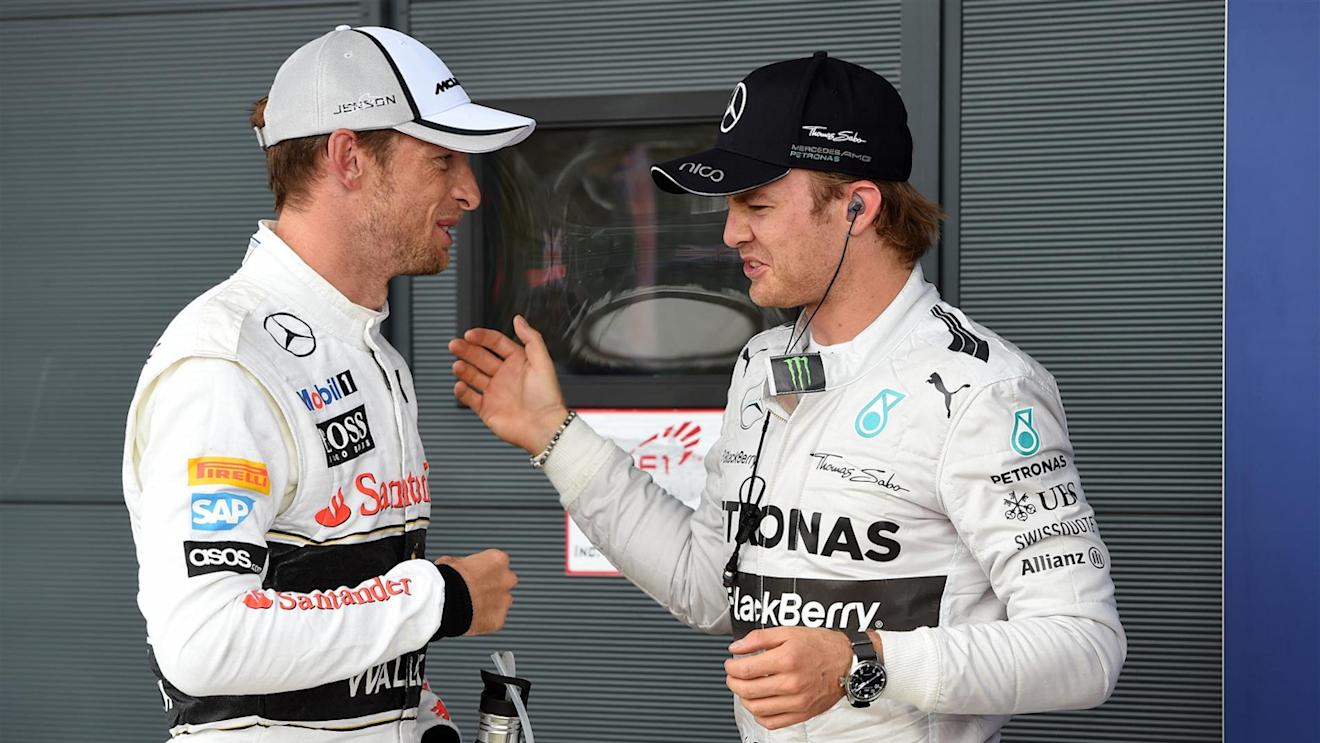 Jenson Button (GBR) McLaren and pole sitter Nico Rosberg (GER) Mercedes AMG F1 celebrate in parc ferme. Formula One World Championship, Rd9, British Grand Prix, Qualifying, Silverstone, England, Saturday, 5 July 2014