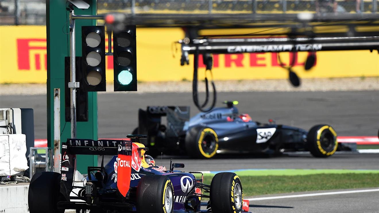 Sebastian Vettel (GER) Red Bull Racing RB10 and Kevin Magnussen (DEN) McLaren MP4-29. Formula One World Championship, Rd10, German Grand Prix, Practice, Hockenheim, Germany, Friday, 18 July 2014