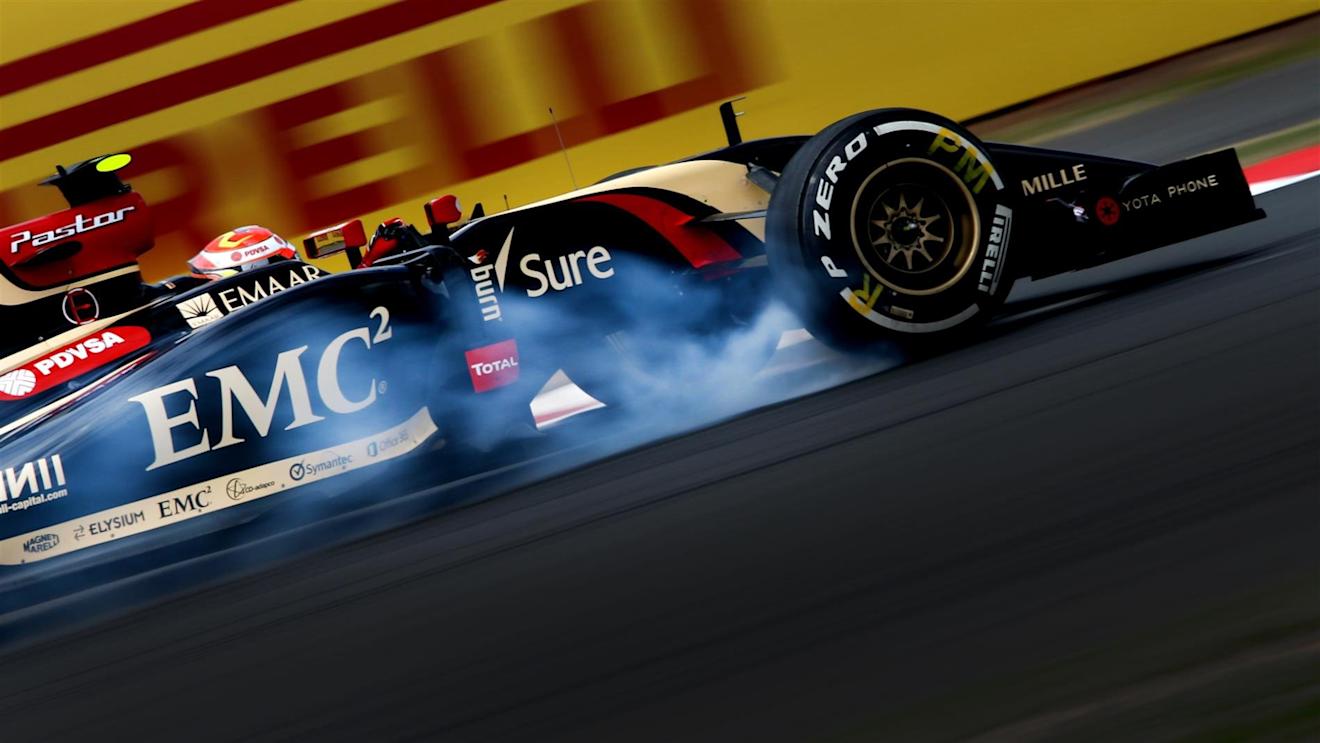 Pastor Maldonado (VEN) Lotus E22 locks up. Formula One World Championship, Rd9, British Grand Prix, Practice, Silverstone, England, Friday, 4 July 2014