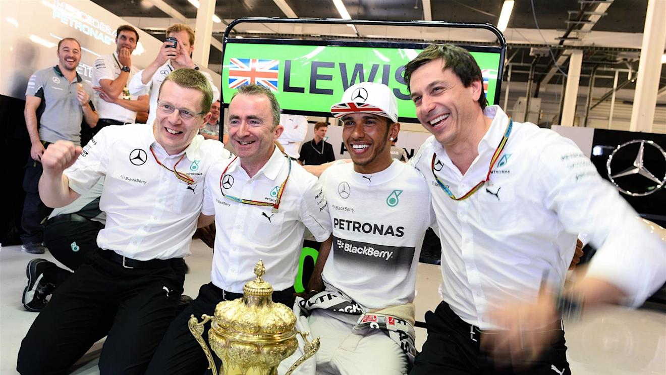 (L to R): Andy Cowell (GBR) Managing Director, Mercedes AMG High Performance Powertrains in the Press Conference, Paddy Lowe (GBR) Mercedes AMG F1 Executive Director (Technical), race winner Lewis Hamilton (GBR) Mercedes AMG F1 and Toto Wolff (AUT) Mercedes AMG F1 Director of Motorsport celebrate with the trophy. Formula One World Championship, Rd9, British Grand Prix, Race Day, Silverstone, England, Sunday, 6 July 2014